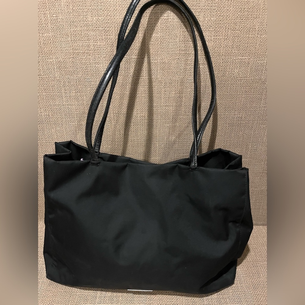 Desmo ~ Preloved bag with multiple inside compartments.